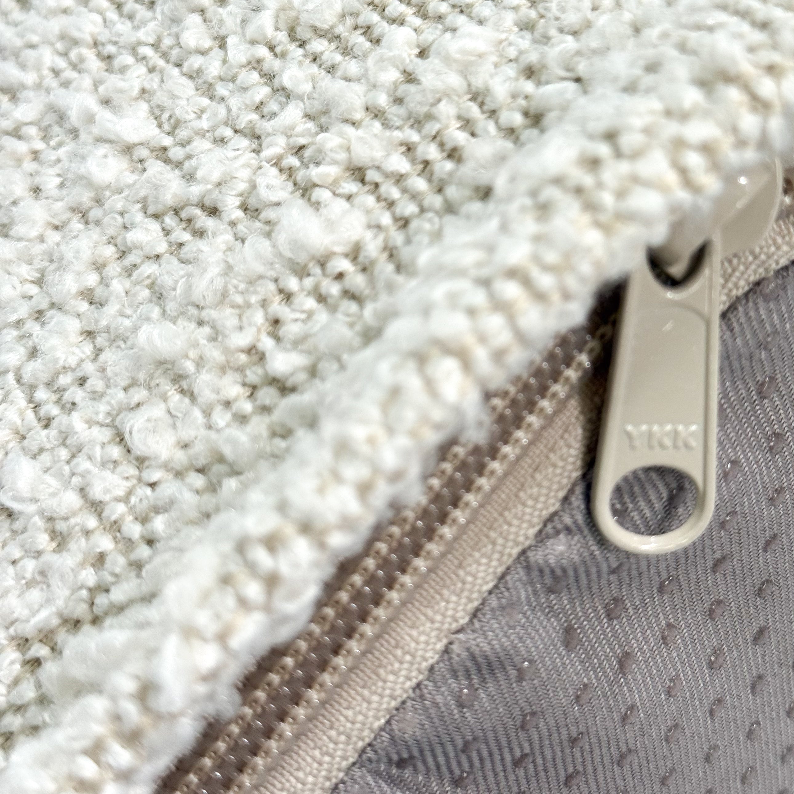 Close-up shot of the YKK zipper on the dog bed cover.