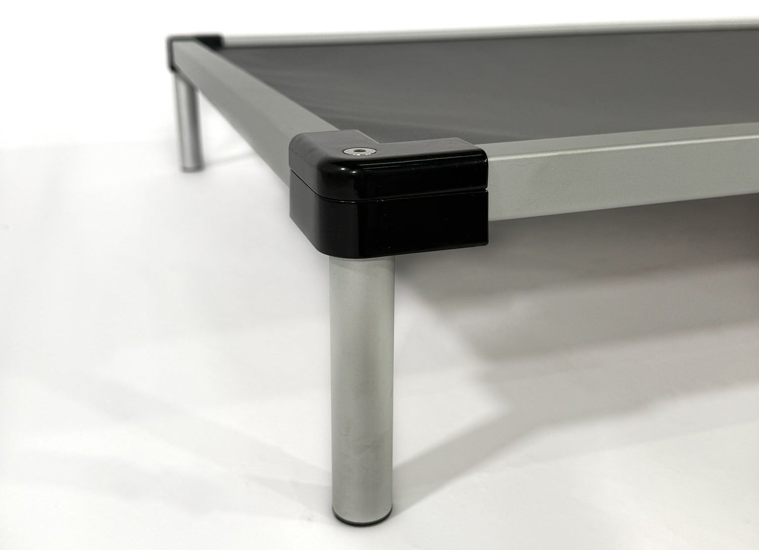 Metal frame with a black corner guard on a white background