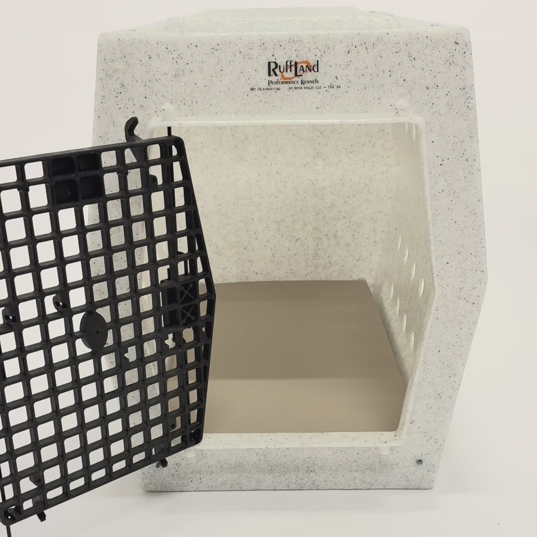 German Shepherd walking into a dog crate and laying down on a crate pad.