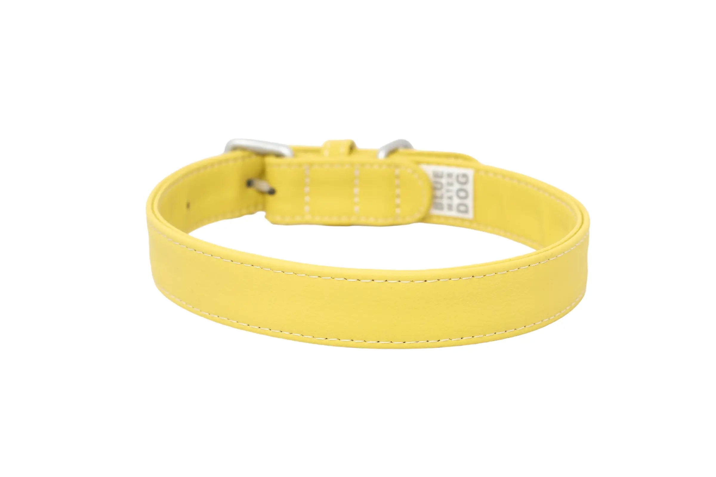 Back of a waterproof and durable dog collar with vegan leather and marine grade anodized aluminum hardware in the color honey yellow.