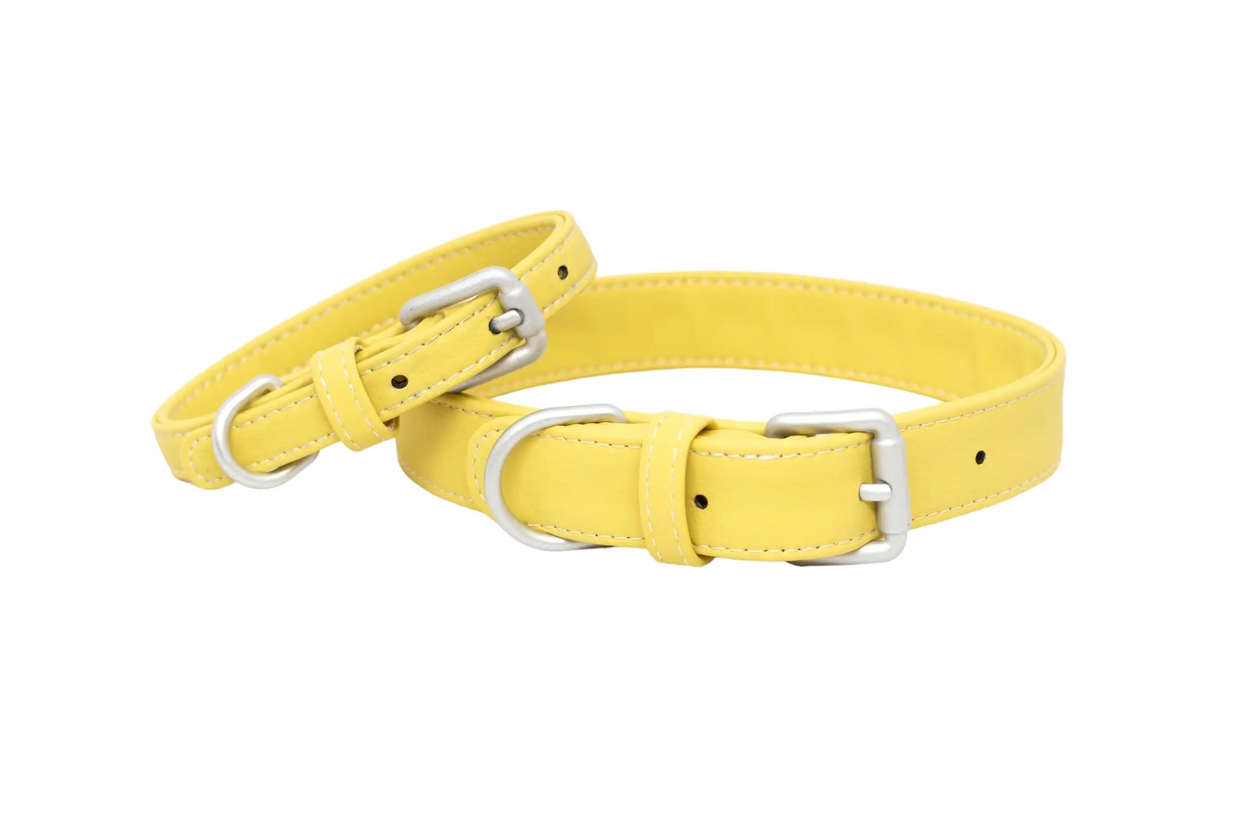 Front of two waterproof and durable dog collars with vegan leather and marine grade anodized aluminum hardware in the color honey yellow.