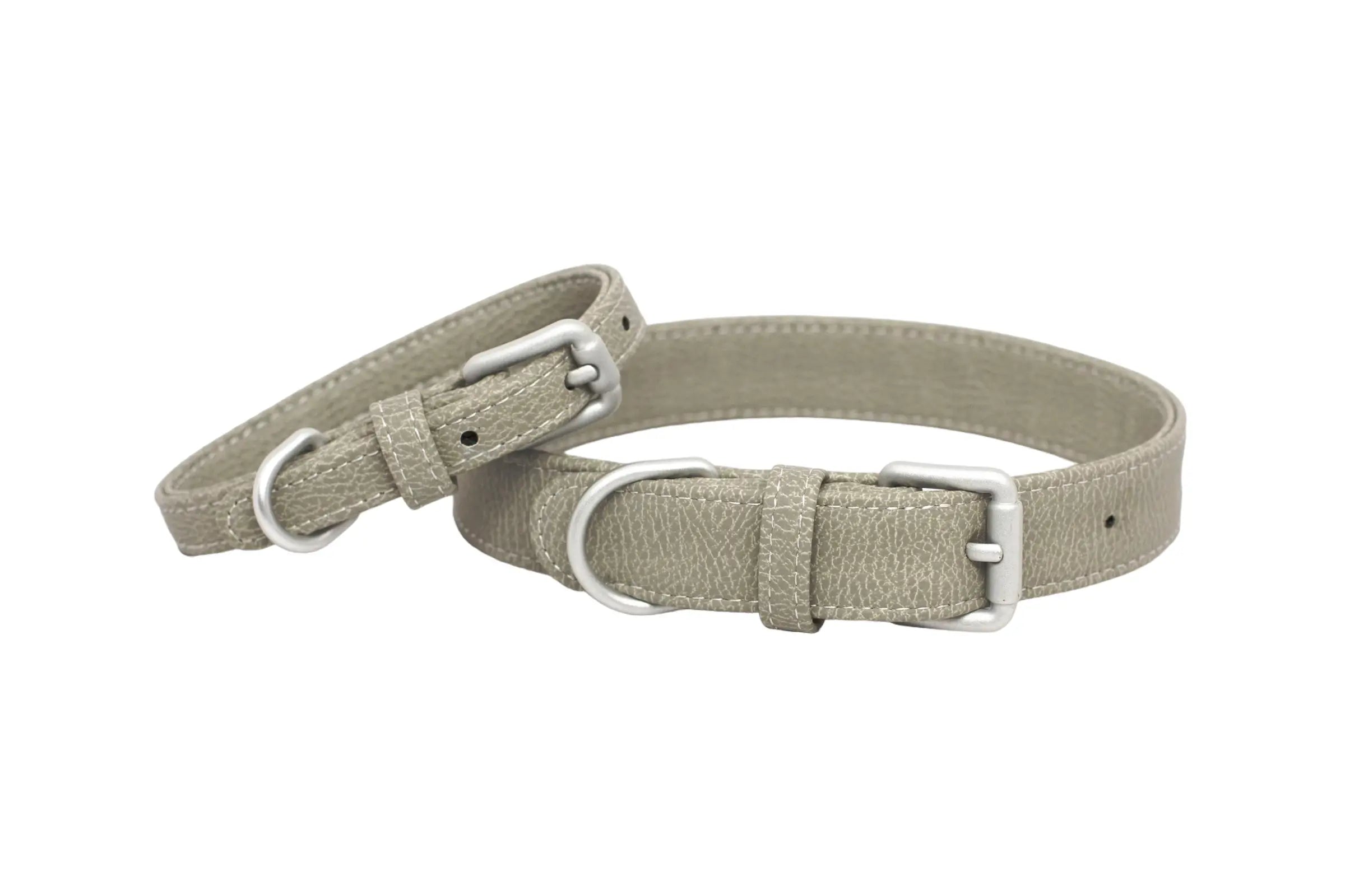Front of two waterproof and durable dog collars with vegan leather and marine grade anodized aluminum hardware in the color winter gray.